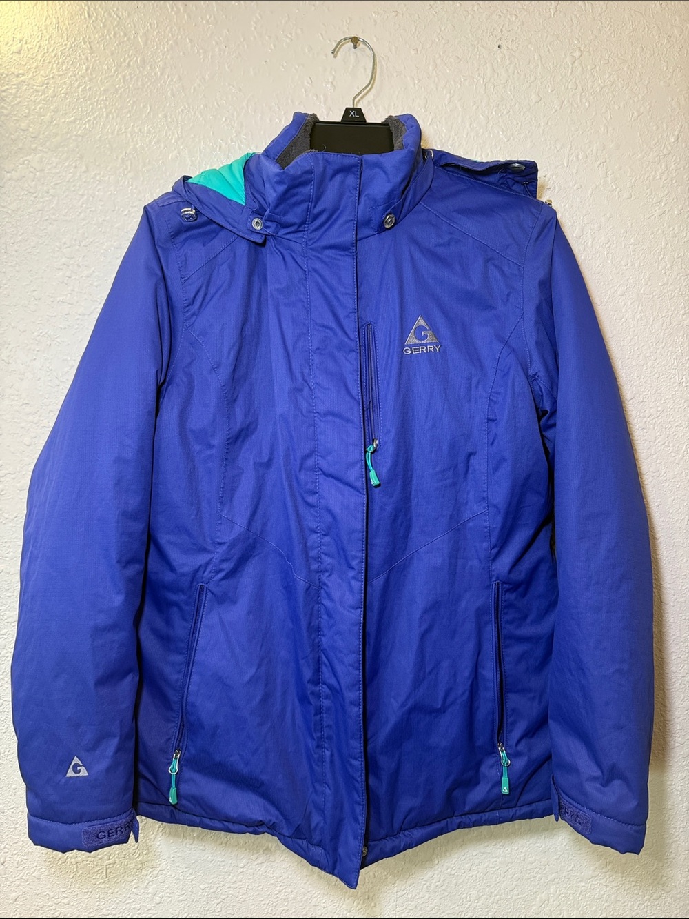 Gerry  woman’s Hooded ski Jacket in Bright Blue with Teal Accents